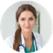 Portrait of Laura Bennett, clinic operations manager, in a white coat with a stethoscope